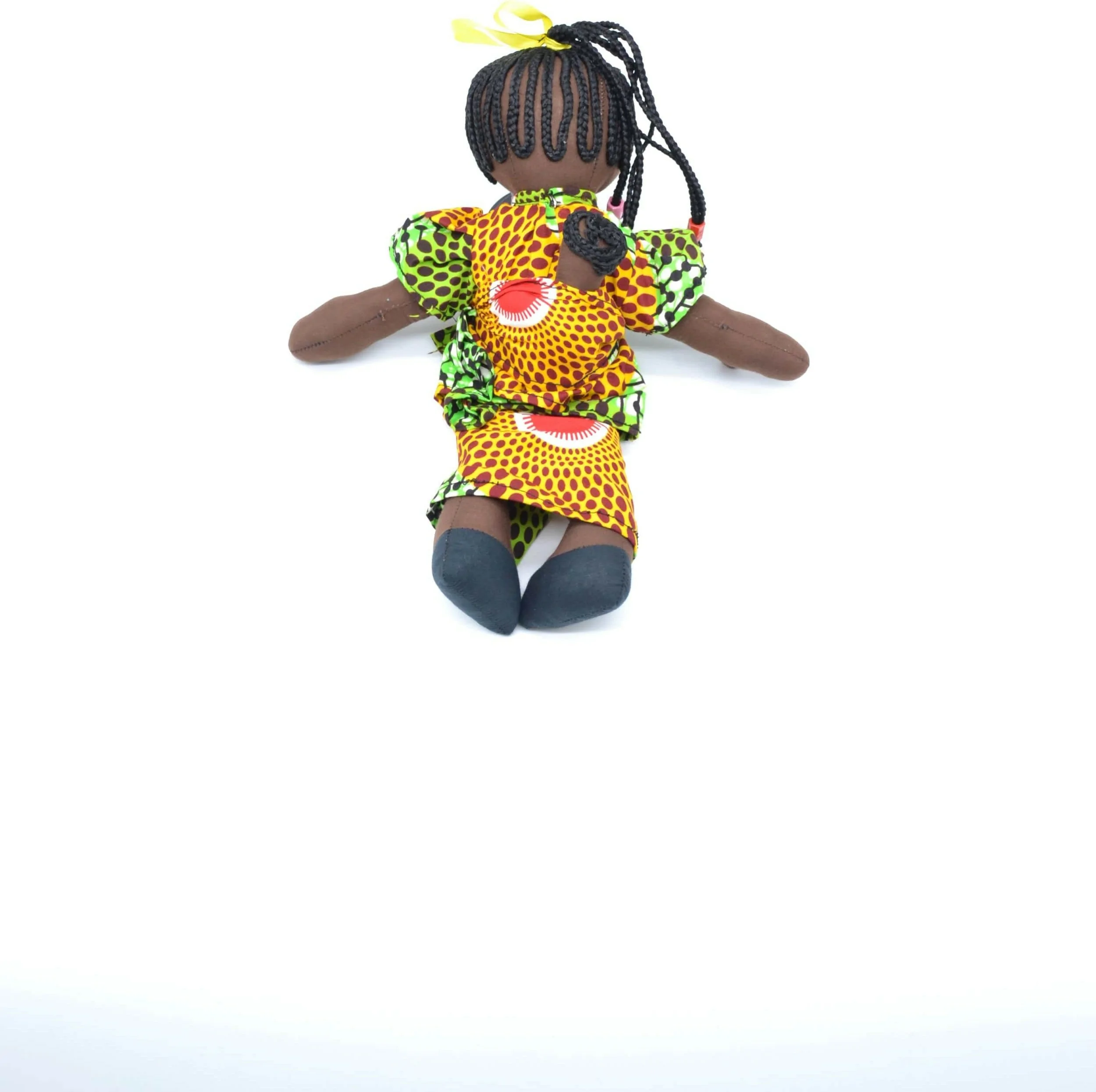 Poupée de chiffon avec robe verte et jaune en tissu wax